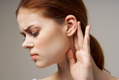 woman ear pain otitis media health problems infection light background. High quality photo